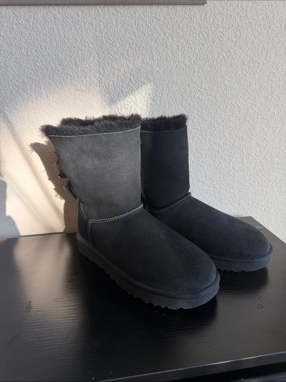UGG Women's Black Suede Shearling Short Boots with Bow Detail